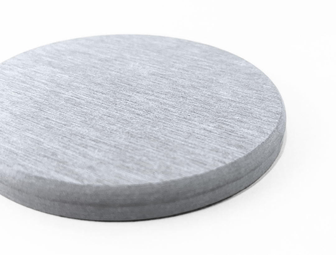 Round gray coaster on a white background