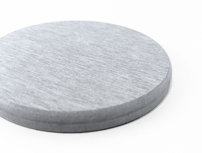 Round gray coaster on a white background
