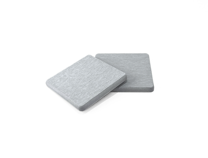 Two gray square coasters on a white background