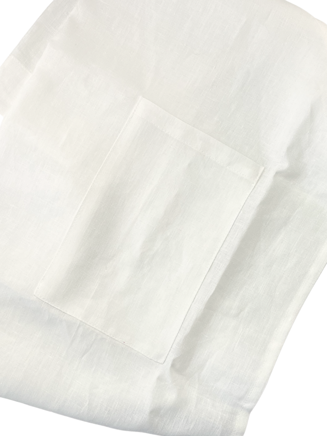 Close-up of a light beige apron with a pocket on a white background