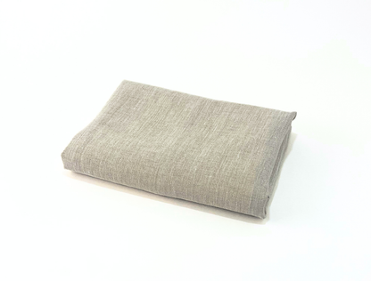 Gray linen towel on a white background